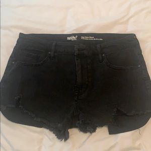 Black denim shorts. Distressed detailing